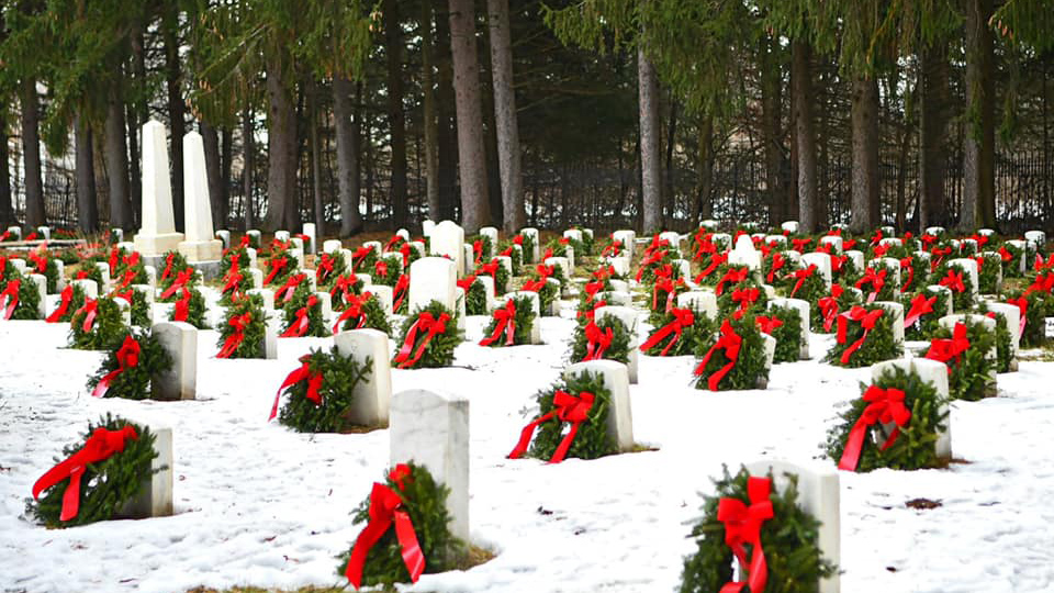 Photo of the Wreaths for Veterans laid at each headstone at the Sackets Harbor Military Cemetery in 2021