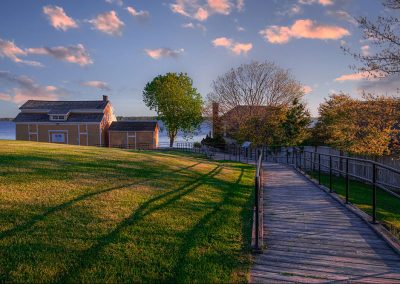 Photo of the boardwalk and Navy Yard buildings at the Battlefield at sunrise