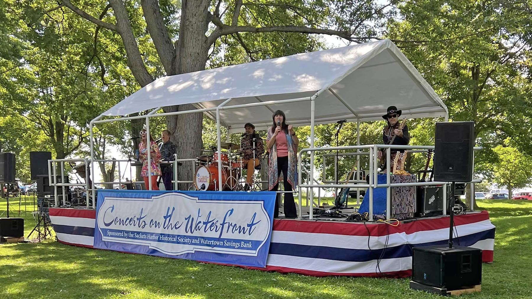 The Large Flowerheads band performing during the 2023 Concerts on the Waterfront series at the Sackets Harbor Battlefield