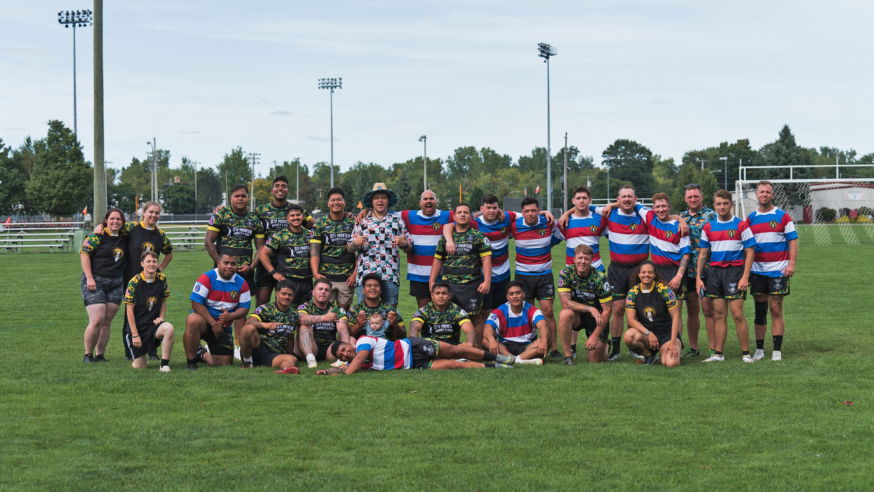 Photo of the members of the Barracks Rangers Rugby Club on the pitch