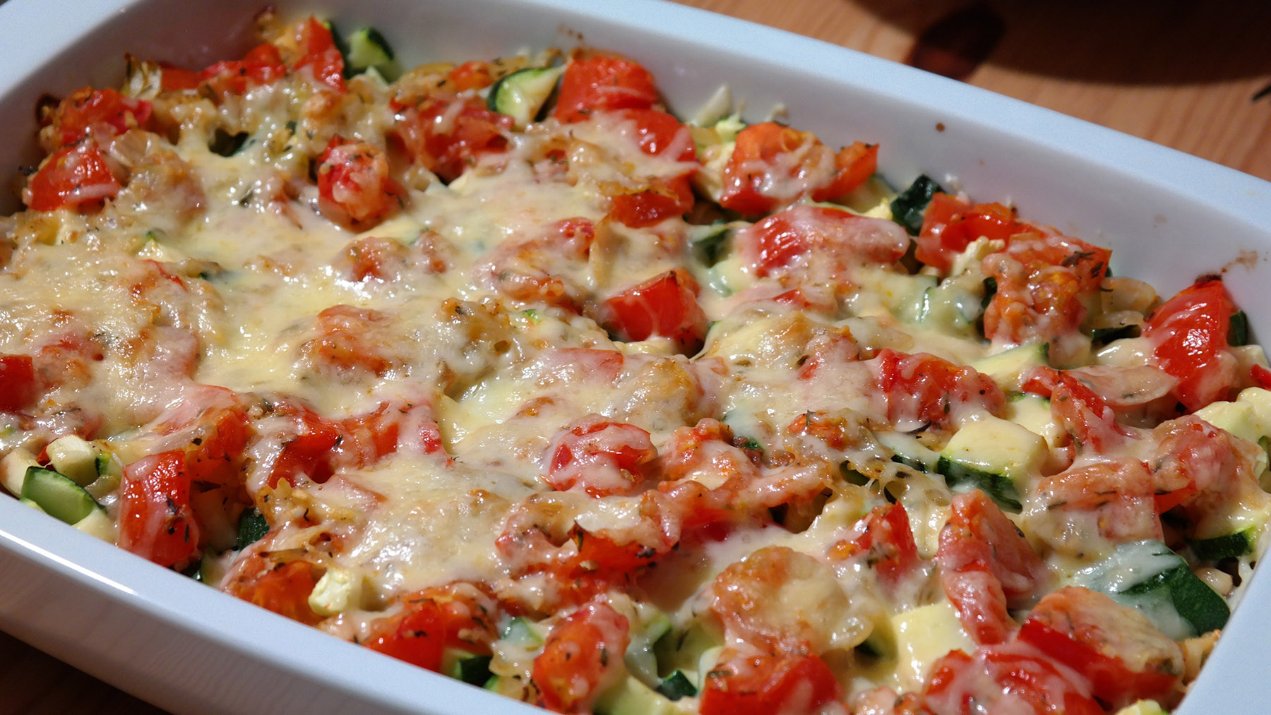 Stock photo of a baked dish with fresh vegetables and melted cheese (Creative Commons image, courtesy of RawPixel.com)