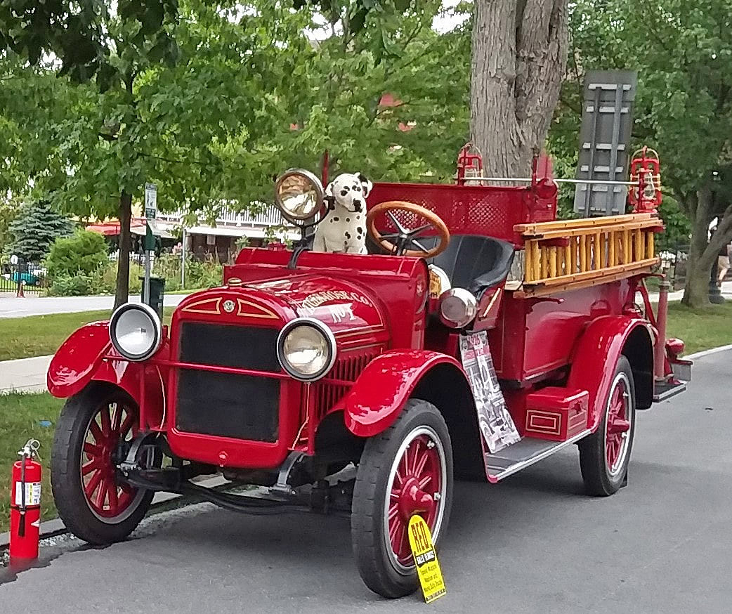 Old fashioned fire truck with Dalmatian