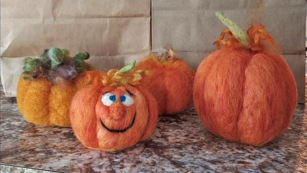 Photo of needle-felted pumpkins on a kitchen counter