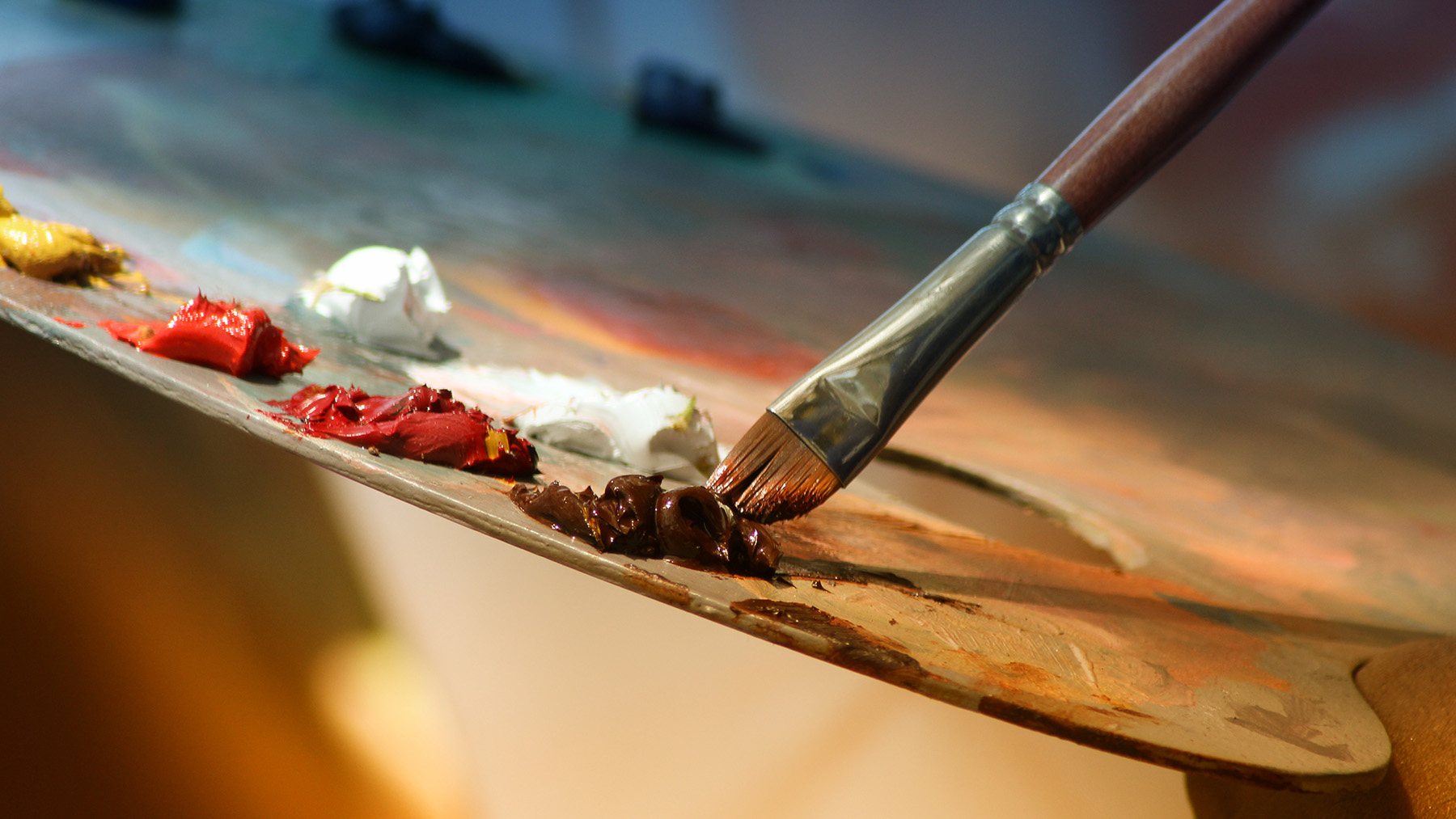 Stock photo of a painter's paint easel and brush (Image from Creative Commons)