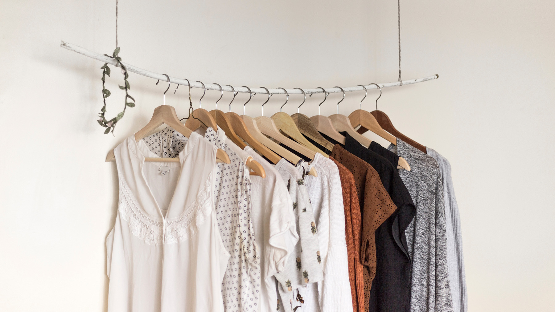 Stock photo of clothes hanging on a single rack (Image from Wikimedia Commons, courtesy of RawPixel.com)