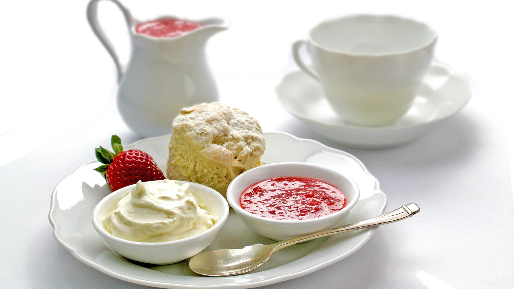 Color photo of tea and a scone with toppings from Creative Commons (courtesy of RawPixel.com)