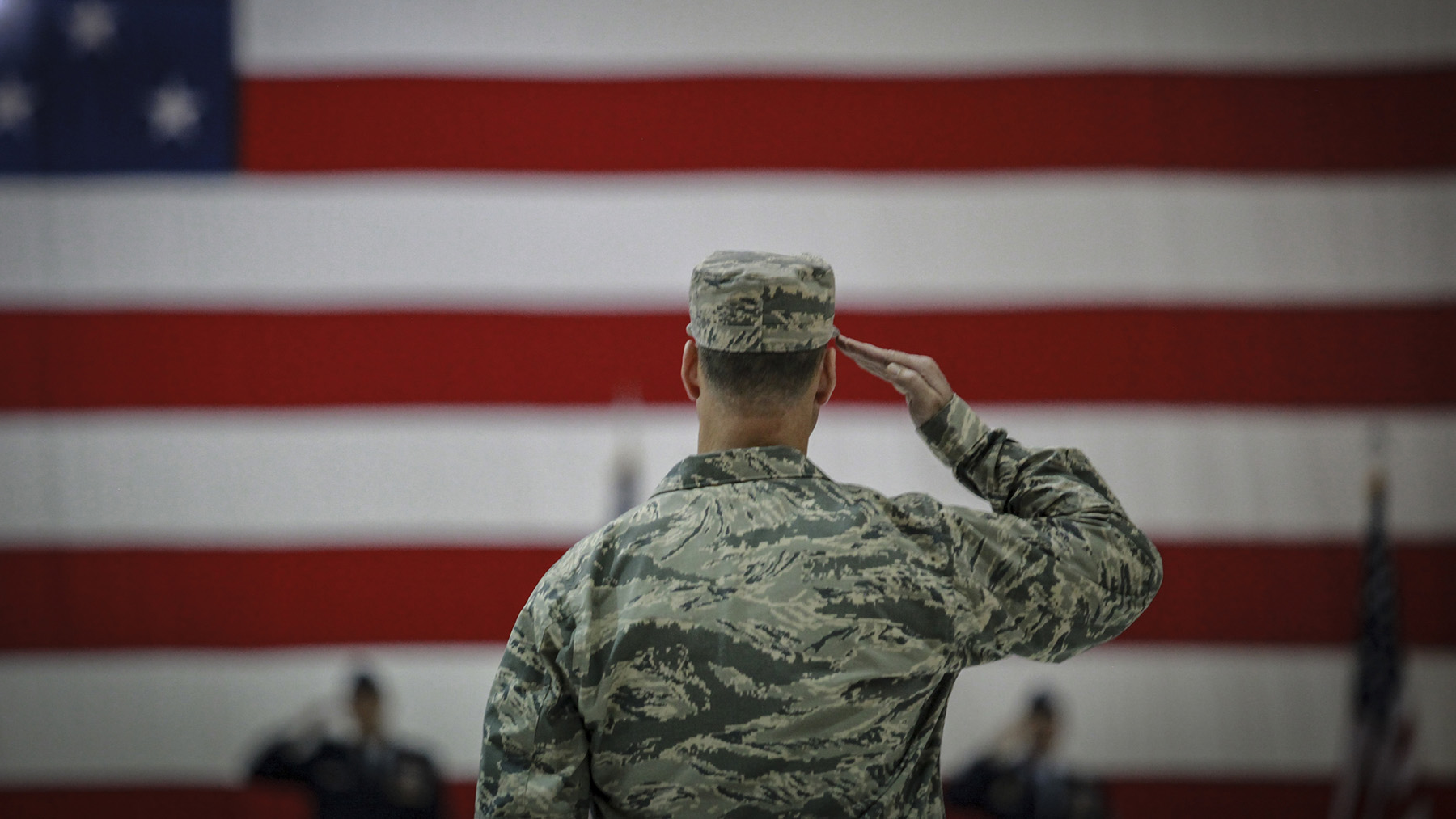 Photo of a U.S. airmen saluting during an assumption of command ceremony. Public domain image, courtesy of RawPixel.com